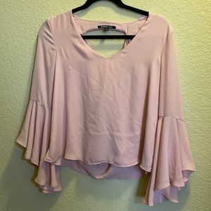 Dillards size small bell sleeve and open back light pink blouse